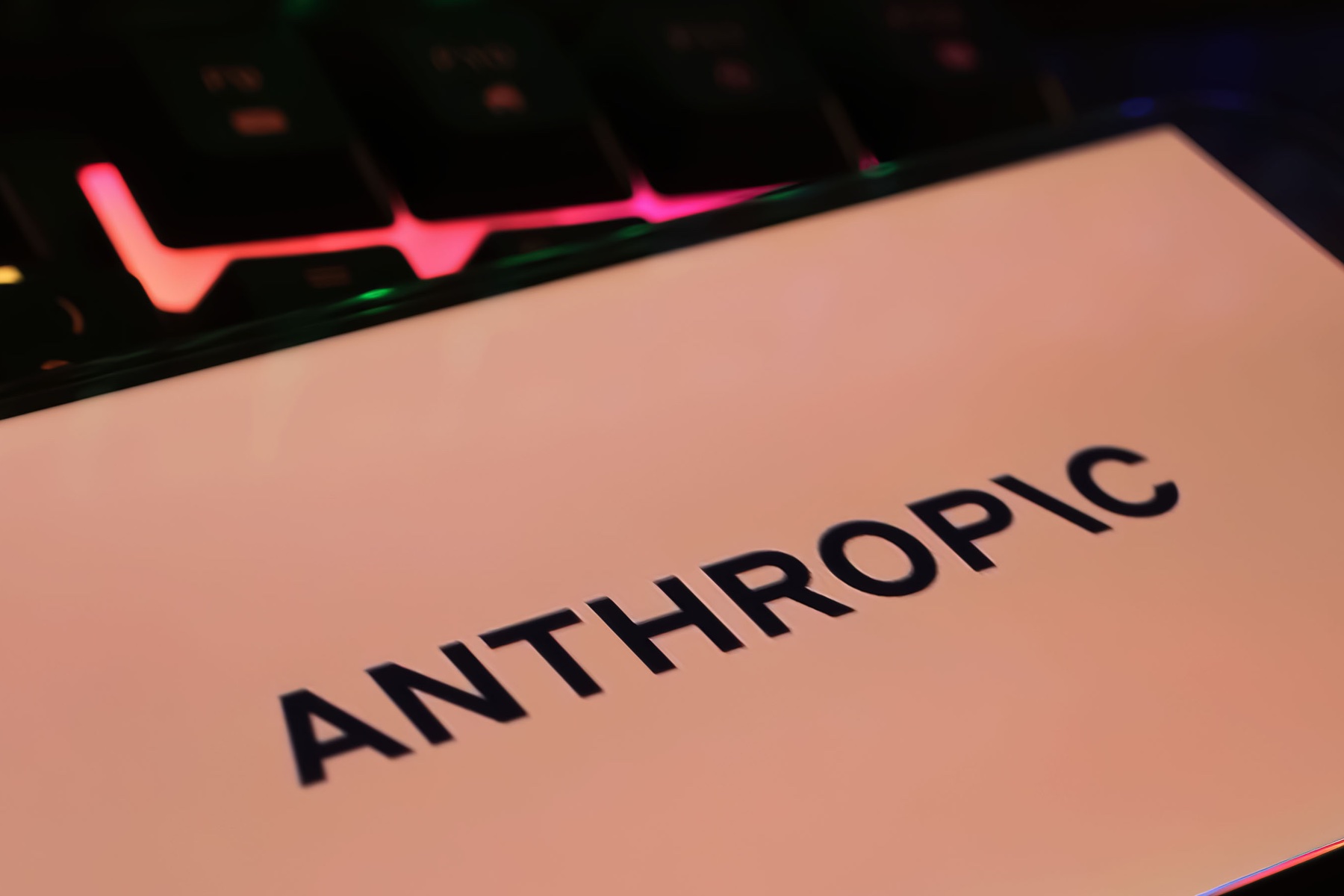 Closeup of smartphone with logo lettering of Anthropic AI company. 