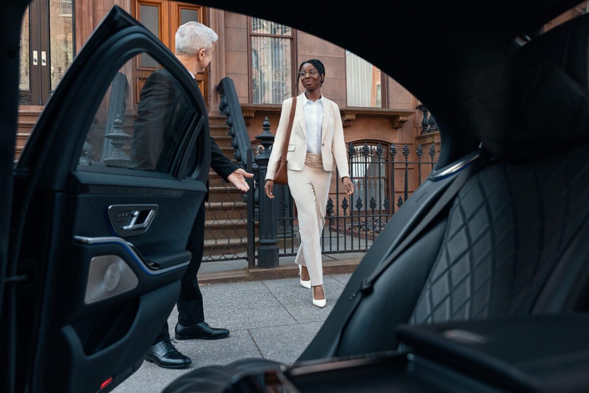 Pictured: Blacklane guest and chauffeur. 