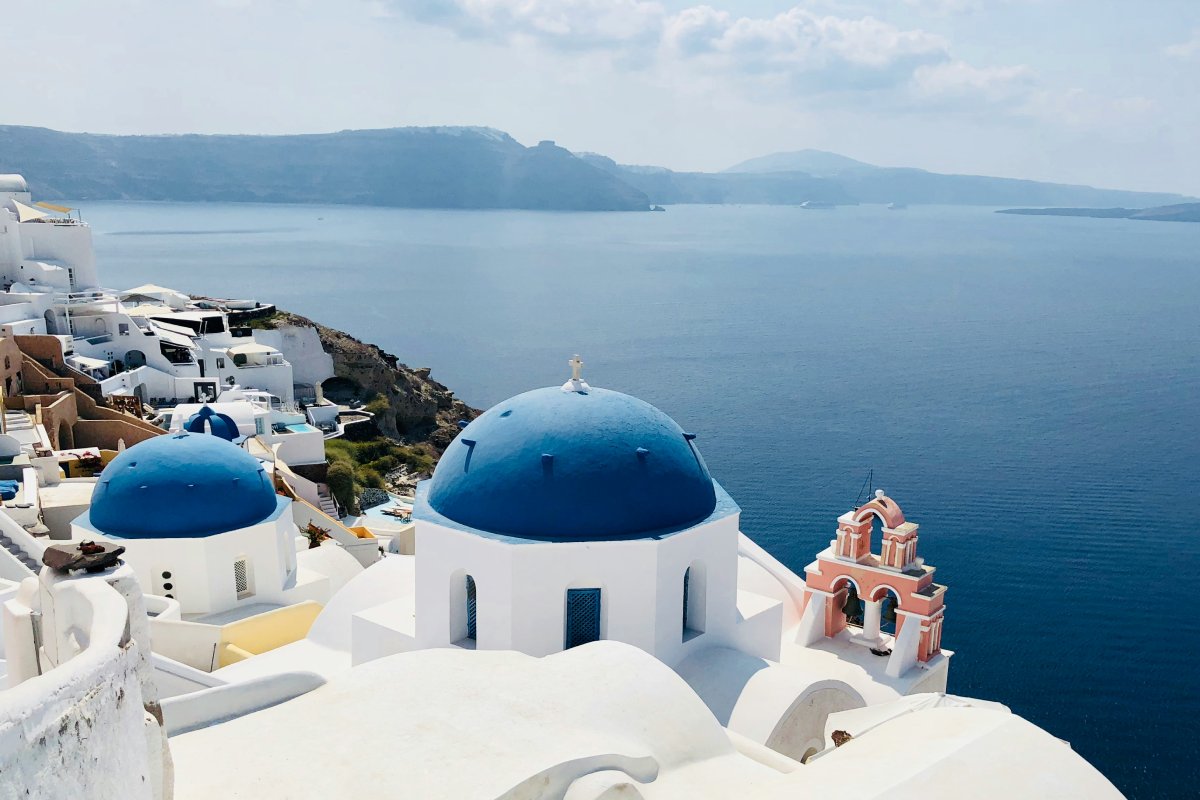 Overlooking the famous blue church domes in the town of Oia, isle of Santorini, Greece.