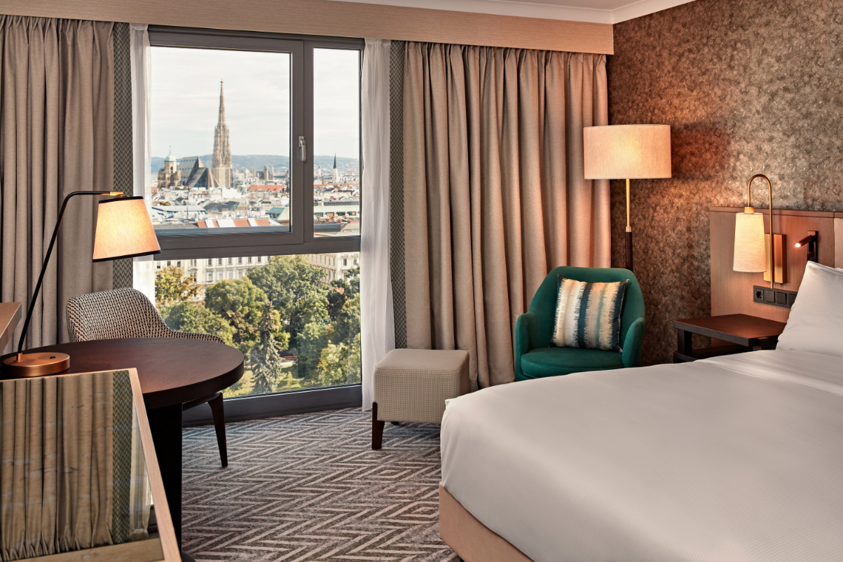 Hilton Vienna Park hotel king premium room with park view.