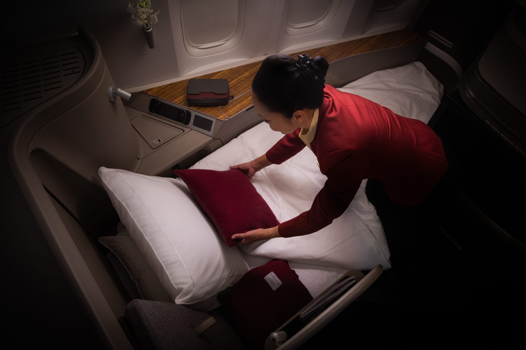 A flight attendant pictured in Cathay's current first class cabin.