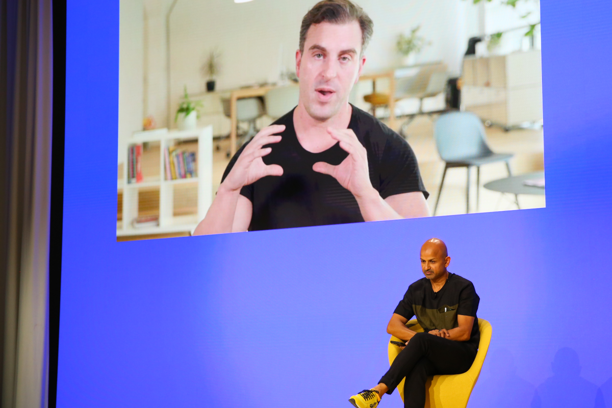 Pictured: Airbnb CEO Brian Chesky speaks remotely with Skift CEO Rafat Ali at the Skift Global Forum